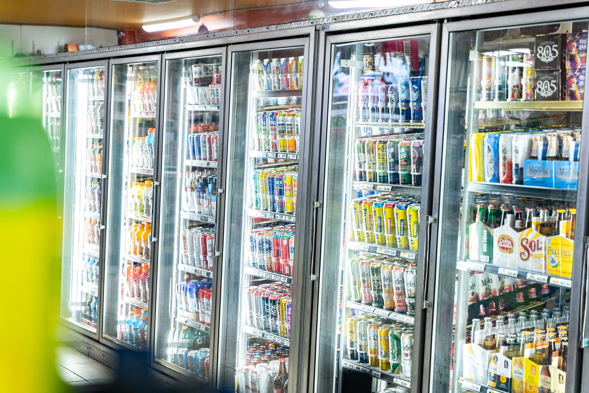 Refrigerated coolers of Mexican sodas, beverages, and beer at Carnicería 99